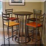 F09. Damian Velasquez high top table with 4 chairs. Table: 42”h Chairs: 30”h 